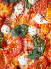 Classic Margherita pizza with a thin, crispy crust, rich tomato sauce, melted mozzarella, and fresh basil leaves. Served on a rustic wooden board with a warm, textured background, emphasizing its