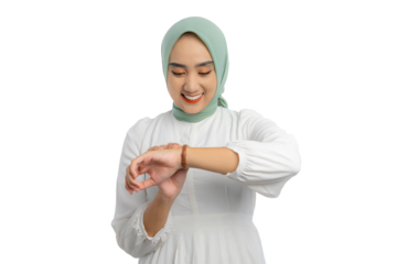 Beautiful young Asian woman in green hijab and white blouse checking time on his watch with happy expression isolated on transparent background