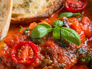 Classic Italian lasagna with rich tomato sauce, cherry tomatoes, basil, and melted cheese. Served...
