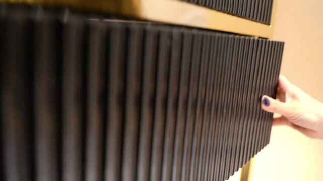 Opening a Ribbed Black Drawer with Style