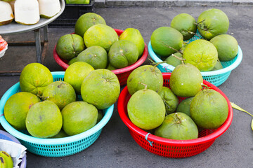 Fresh pomelo fruits for sale at a local market in Vietnam