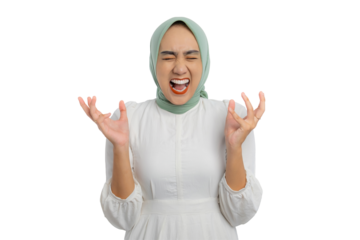Angry young Asian woman in green hijab and white blouse raising hands and shouting with frustrated expression isolated on transparent background