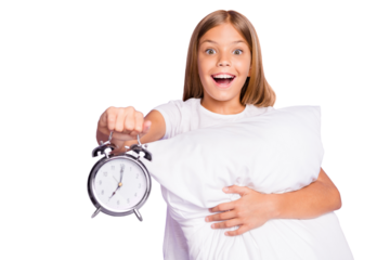 Portrait of cheerful surprised funky kid hold hand pillow show early time awake want start new day feel excited emotions on weekends enjoy mornings wear white t-shirt isolated purple color background