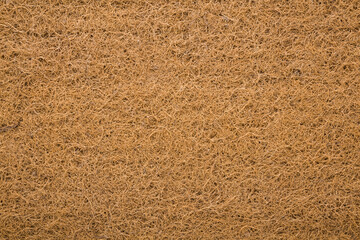 Brown coconut coir background of orthopedic mattress layer. Closeup. Top down view.