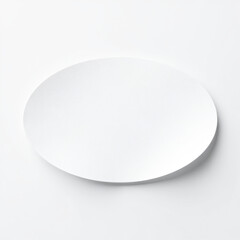 Oval-shaped white paper sticker, blank adhesive label, soft lighting, minimal modern visual