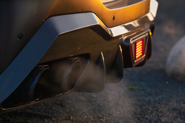 Spitting exhaust fumes and splashing water from the exhaust, the classic sports car