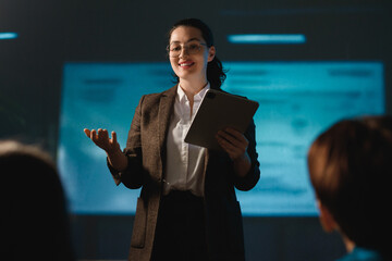 A woman is speaking on stage