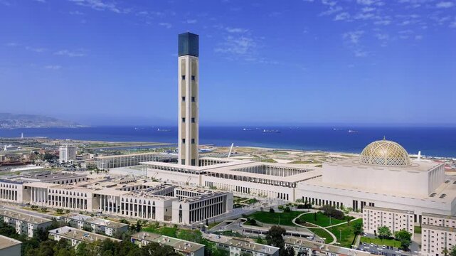 drone shot of the great mosque of algiers with the sea view in the background on a sunny day - Masdjid el djazaier