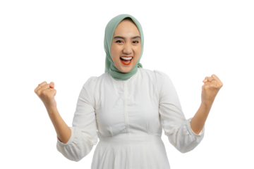 Happy young Asian woman in green hijab and white blouse giving thumbs up and smiling broadly isolated on transparent background