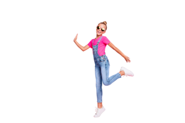 Full length body size photo of nice cute excited ecstatic schoolgirl dancing while having holiday isolated over pastel color background