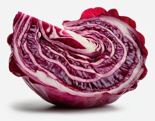Obraz premium Cross-section of vibrant red cabbage showcasing intricate layers and rich colors.