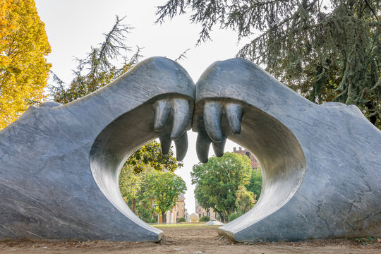 The funny entrance of a children's playground in the shape of a double mouth of hippopotamus, Piazza Gramsci square, historic center of Carrara, Italy
