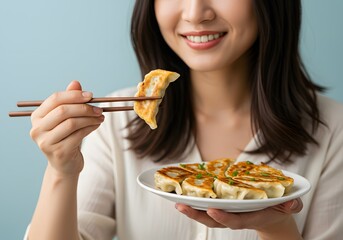 Woman Eating Delicious Fried Dumplings with Chopsticks, Plate of Gyoza, Asian Cuisine, Healthy Meal