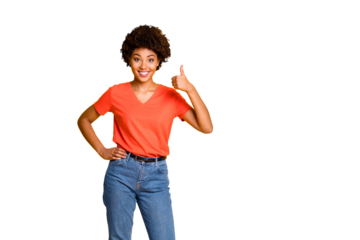 Copyspace photo of charming cheerful nice woman wearing jeans denim orange t-shirt thumbing up holding hand on waist standing confidently isolated over bright color background