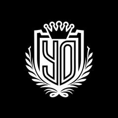 YO Letter logo heraldic shield shape with crown on black background template design