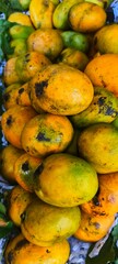 a large pile of ripe yellow mangoes