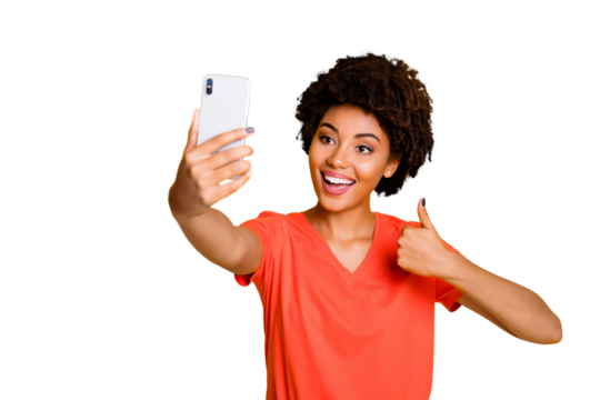 Photo of stylish trendy cheerful curly wavy model gorgeous sweet charming girlfriend thumbing up symbol smiling toothily approving something wear t-shirt isolated yellow bright color background