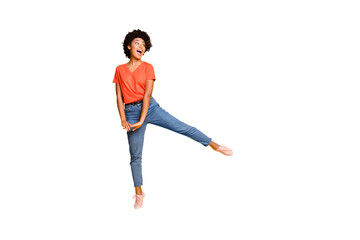 Full length body size photo of cheerful cute nice rejoicing overjoyed african youngster seeing her favorite goods discounted wearing jeans denim sneakers isolated vivid color background