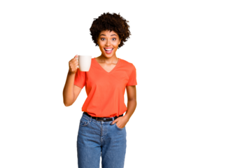 Photo of charming cute cheerful nice attractive girlfriend wearing orange t-shirt denim jeans holding cup of tea isolated over yellow vivid color background