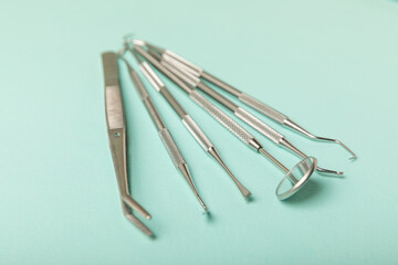 Dentist tools on a blue background. Dentist Concept.Teethcare, dental health concept. Means to care for the oral cavity. Dental model and dental equipment. Dental hygiene. Space for text. Copy space.