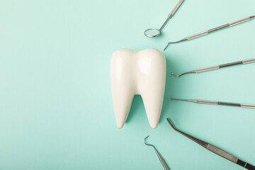 Dentist tools on a blue background. Dentist Concept.Teethcare, dental health concept. Means to care...