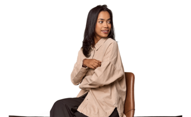 Seated Filipino woman looking at camera