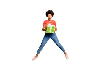 Full length body size photo of attractive fashionable stylish cute charming girlfriend jumping up wearing jeans denim t-shirt jumping with ribbon isolated vivid color yellow background