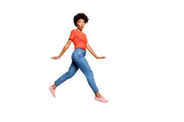 Full length body size photo of charming pretty funny cute girlfriend running away from something curly wavy wearing jeans denim isolated over yellow vivid color background