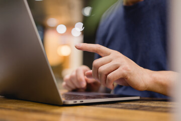 Social media and digital online concept, man using computer. The concept of living on vacation and playing social media. Social Distancing ,Working From Home