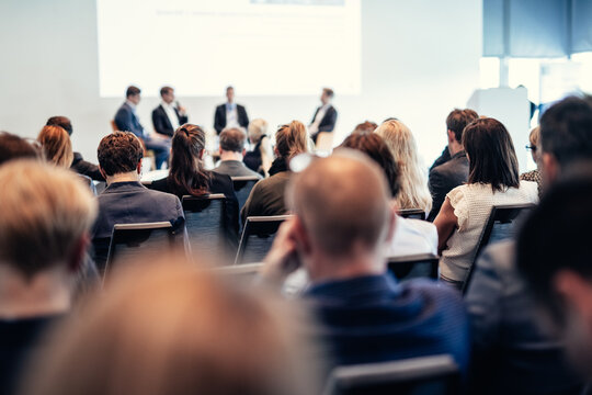 Interview and round table discussion at business convention and presentation. Audience at the conference hall. Business and entrepreneurship symposium.