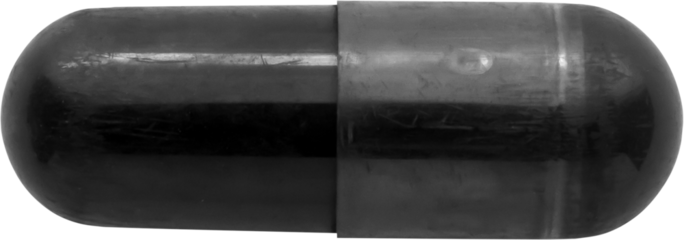 Black medicine pill activated charcoal capsule isolated on white background