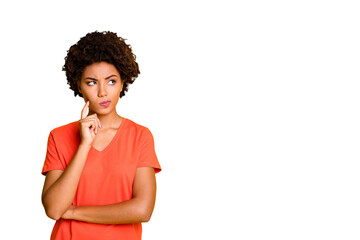 Photo of funny dark skin lady doubtful about making important decision wear orange v neck t-shirt...