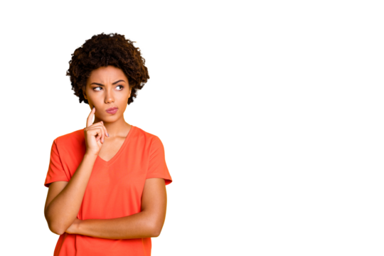 Photo of funny dark skin lady doubtful about making important decision wear orange v neck t-shirt isolated yellow color background