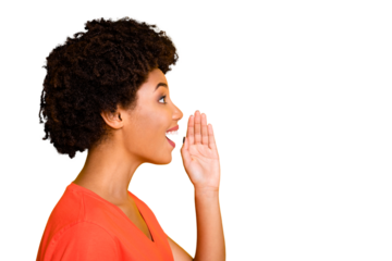 Photo of pretty wavy dark skin lady sharing new information with people holding arm near mouth wear orange t-shirt isolated yellow color background