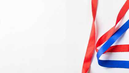 Curled red, white, and blue crepe paper streamers on white background for party decorations, festive events, award ceremonies, and creative design projects