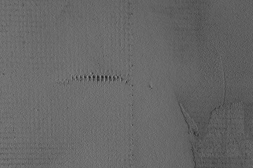 Textured surface revealing subtle patterns and depths in a monochromatic design