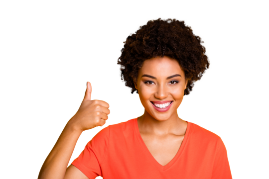 Photo of cheerful cute charming girlfriend thumbing up to show perfect quality of something isolated over yellow vivid color background