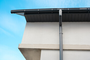Modern architectural design showcased with clean lines and cloudy blue sky