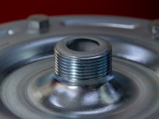 A silver object with a hole in the middle