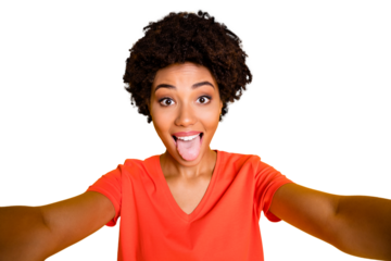 Photo of attractive cheerful sweet pretty curly foolish girlfriend sticking her tongue out taking selfie while isolated over yellow vivid color background