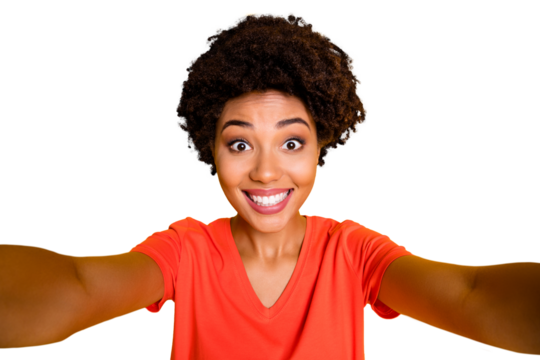 Photo of cheerful nice attractive black girlfriend trendy wearing t-shirt smiling toothily taking selfie isolated over yellow vibrant color background