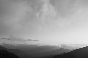 Monochrome mountains and fog. Landscape of the mountain range