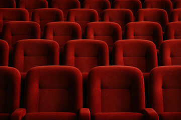 Fototapeta premium Symmetrical red velvet cinema seats in quiet empty theater interior