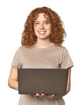 Fototapeta Young Caucasian redhead happy with laptop