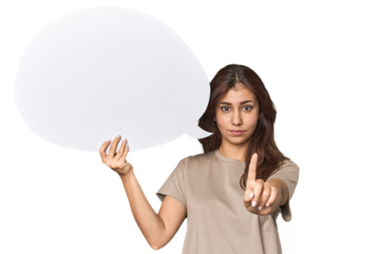 Middle Eastern woman holding comic bubble showing number one with finger.