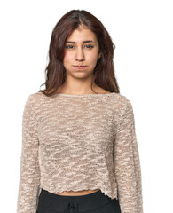 Middle Eastern woman in studio blows cheeks, has tired expression. Facial expression concept.