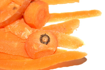 Close up of carrot scrap peelings food waste for compost on white background