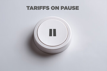 Fototapeta premium White button with pause icon and “Tariffs on Pause” message, symbolizing a halt in economic policy.