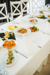 Elegant dining setup with assorted dishes for a special event