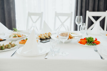 Elegant dining setup with gourmet dishes and refreshments for a special occasion